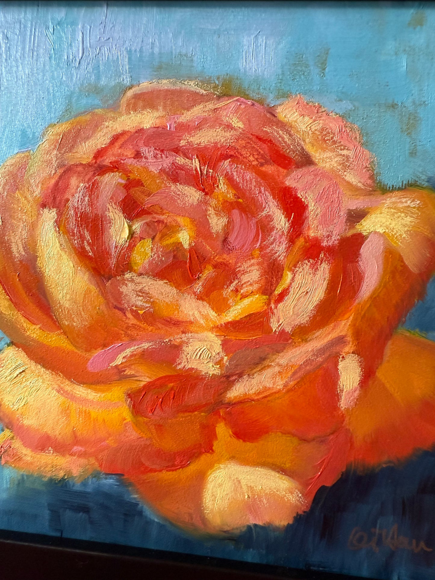 Oil painting of a rose with vibrant orange and red petals on a blue background
